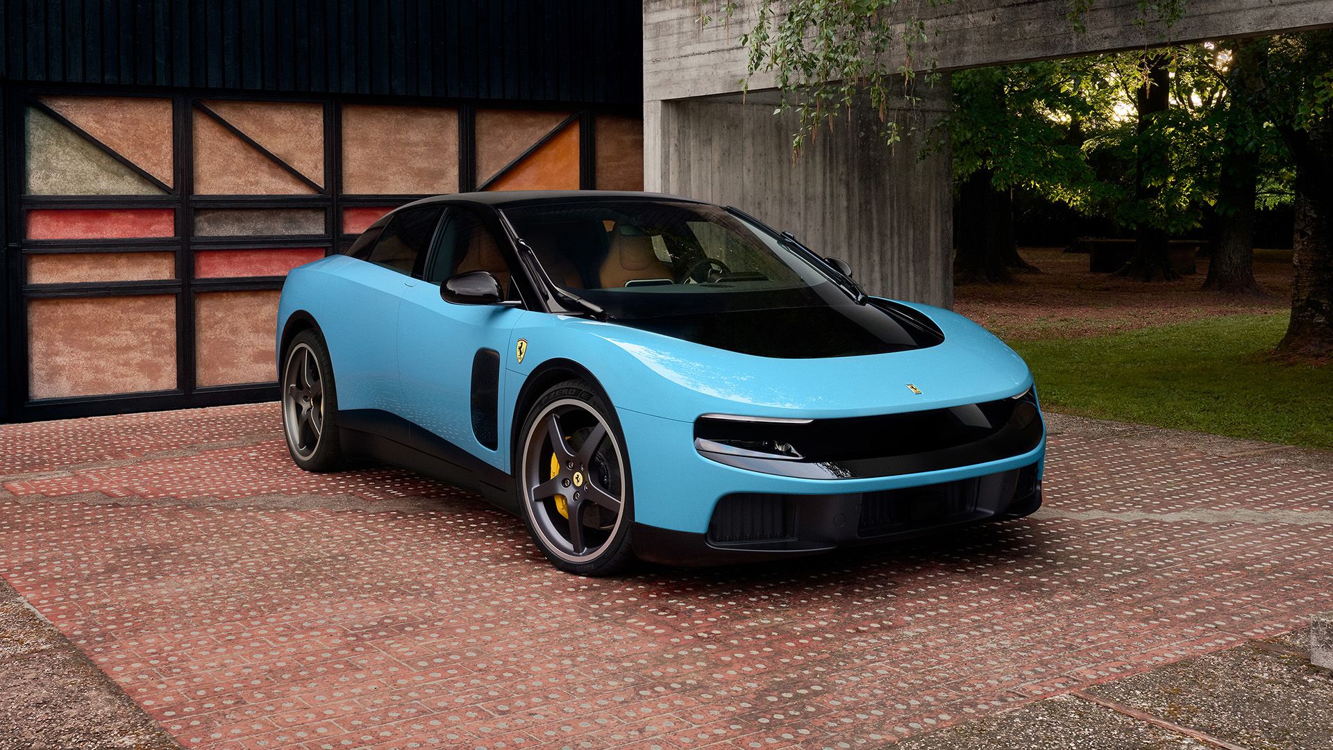 Ferrari Luce — przód i bok (3/4), błękitny nadwozie na tle kamiennego garażu